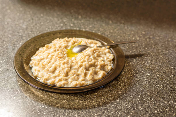 istock Oatmeal with butter on a stone table 1200260173