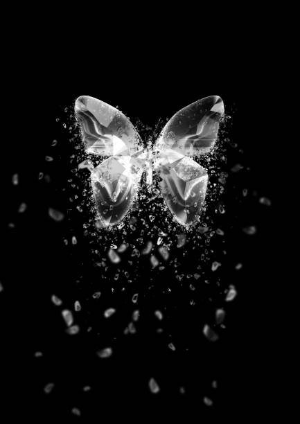 Particles splatter from a glowing abstract butterfly