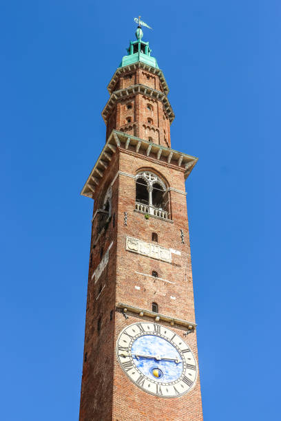 istock View of clock tower (Torre Bissara) at famous square (Piazza dei Signori) in Vicenza. 1200269159