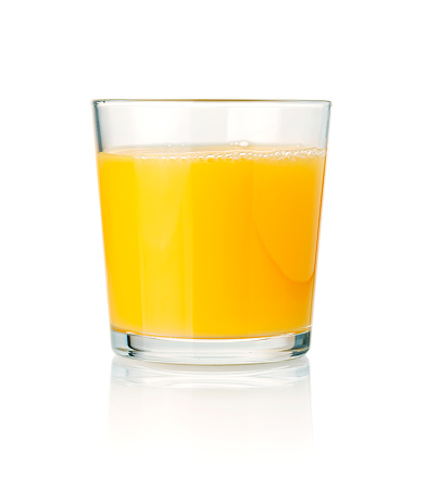 Orange juice glass on white background.