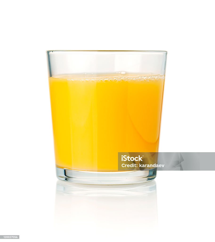 Tumbler glass of orange juice resting on a white surface Orange juice. Isolated on white background Orange Juice Stock Photo