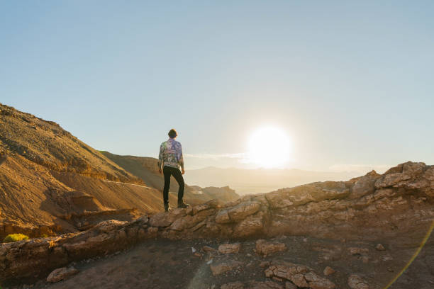 istock Man standing and looking at Valle de la Luna in Atacama desert 1200272754