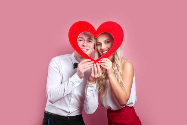 istock Man with her girlfriend celebrating valentine's day 1200274415