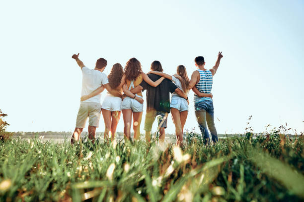 istock A group of people huddle in a field. 1200274621