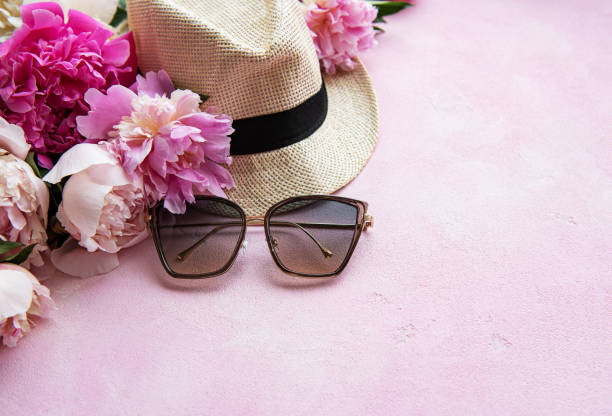 istock Pink peonies and hat on a pink concrete background 1200275449