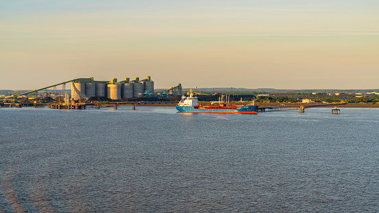 Near Immingham, North Lincolnshire, England, UK - May 14, 2019: View towards the harbour, seen from the River Humber