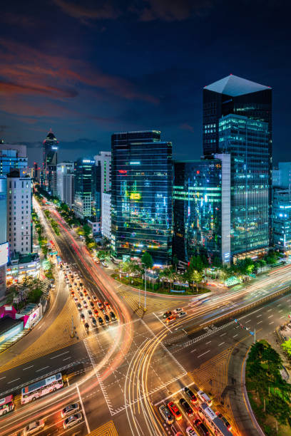 Seoul Gangnam District at Night, South Korea View of famous crowded Crossing at Downtown Gangnam Station at Night with motion blured traffic lights and surrounding modern skyscrapers. Gangnam District, Seoul, South Korea, Asia. kangnamgu stock pictures, royalty-free photos & images