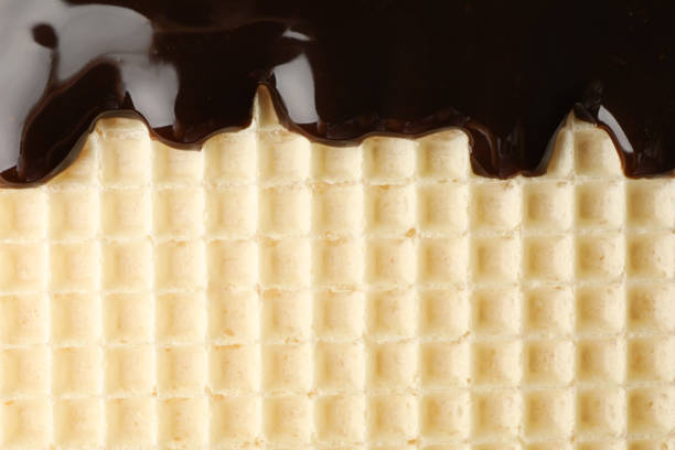 Wafer with chocolate topping texture background, close up
