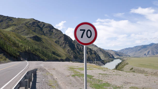 istock Information road sign speed limit within 70 kilometers per hour. A warning about the speed limit in the mountains. Safe journey 1200282182