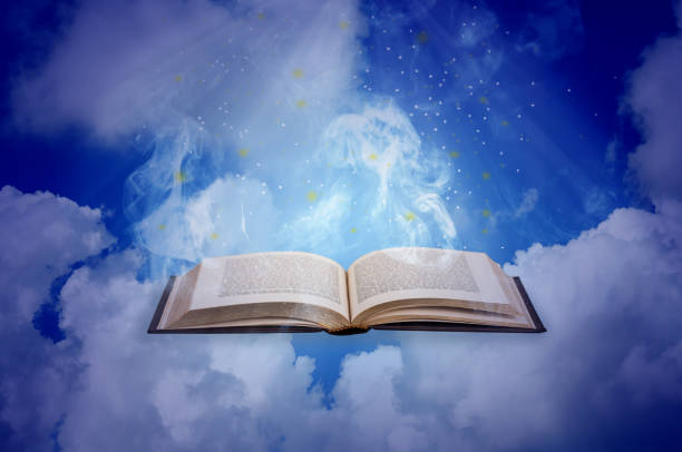 istock Holy bible open book  with cloud and sun ray nature background. 1200286145