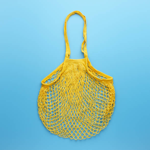 istock Reusable mesh product bag on blue background. 1200290430