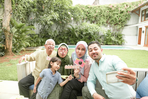 multi-generation family enjoying celebrating birthday