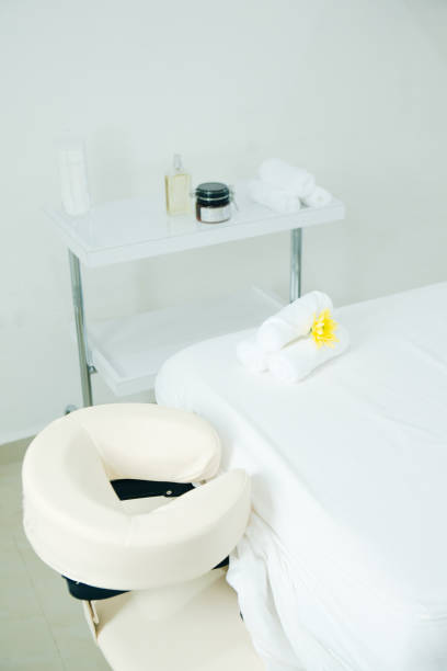 istock massage room in spa saloon. white massage table 1200291861