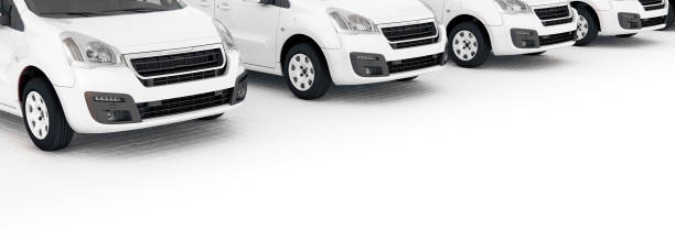 istock E-mobility, electric delivery cargo van parking next to each other generic white layout panorama banner format 3d rendering 1200294332