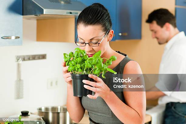 Couple Cooking Together In Kitchen Stock Photo - Download Image Now - 40-49 Years, Adult, Basil
