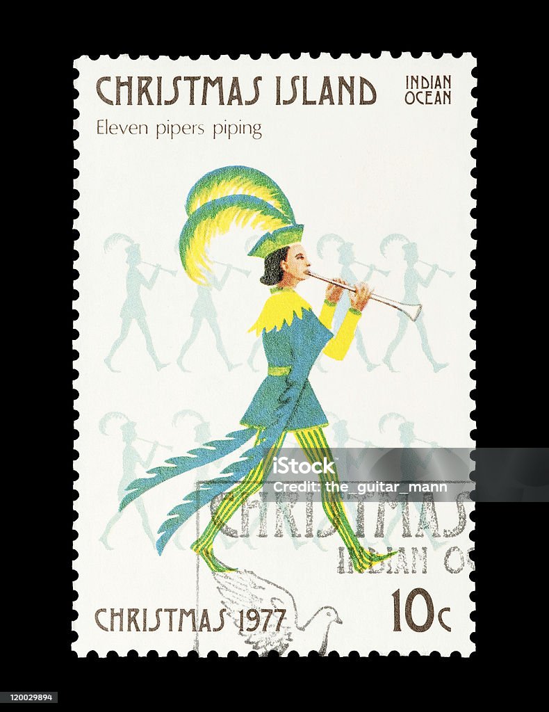 eleven pipers piping Christmas Island mail stamp featuring the eleventh gift from the Twelve Days of Christmas. Images from the other 11 days are also available for download.  The Twelve Days Of Christmas Stock Photo