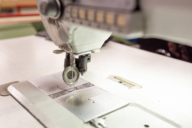 istock Sewing machine working area in the shop. Shoe manufacturing. 1200299415