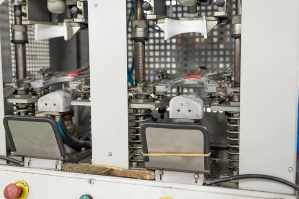istock Machine for forming the front part. Shoe manufacturing. 1200300530
