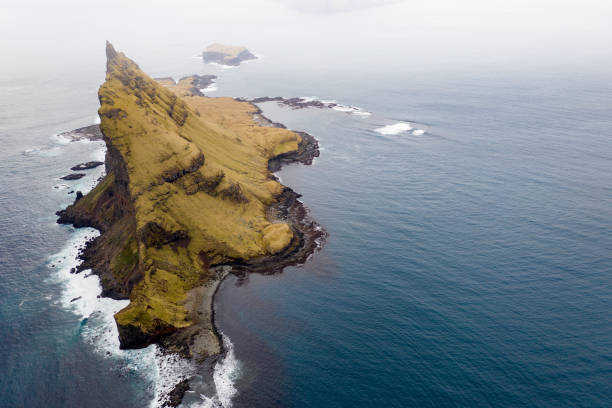 istock Stand alone arial view of Faroe Island cliff 1200300574