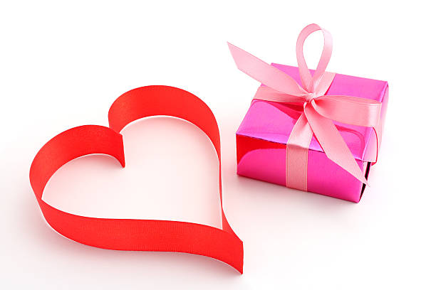 istock Red satin ribbon heart with pink gift wrapped present 120030198