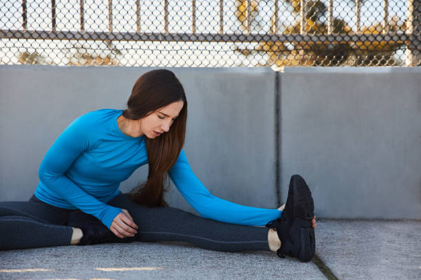 istock Fit young woman stretching before a city run 1200302434