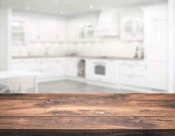 istock clear table top in front of blurry kitchen 1200304387