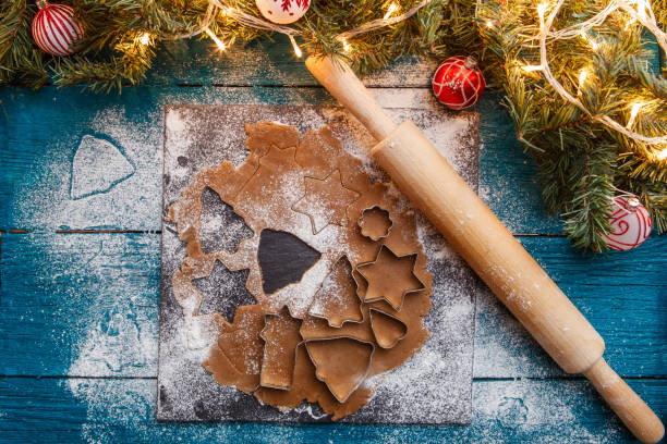 istock Photo of pine branches, dough, biscuit molds, rolling pin 1200306425