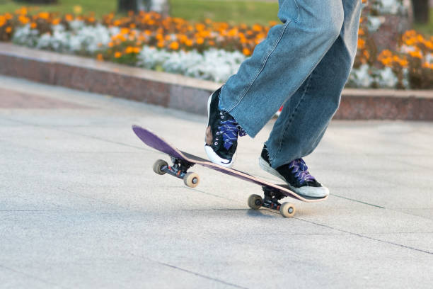 istock Men's legs, on a skateboard, with tricks. 1200306614