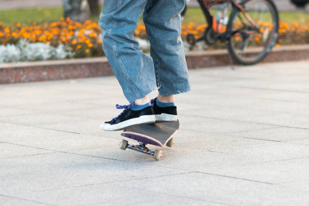 istock Men's legs, on a skateboard, with tricks. 1200306623