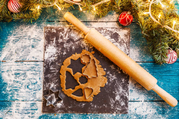 istock Photo of pine branches, dough, biscuit molds, rolling pin 1200306698