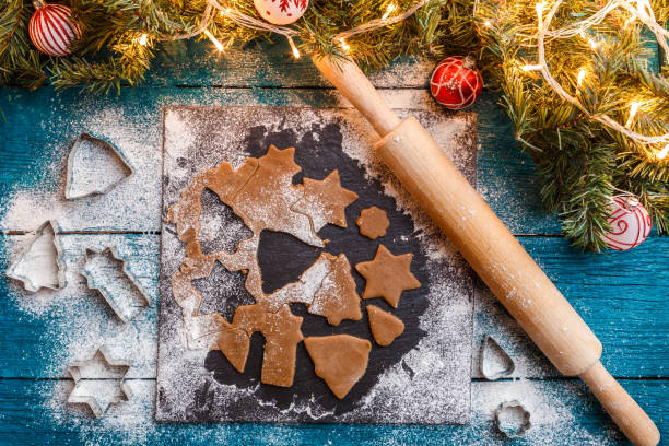 istock Photo of pine branches, dough, biscuit molds, rolling pin 1200306963