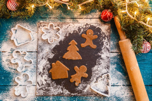 istock Photo of pine branches, dough, biscuit molds, rolling pin 1200308329