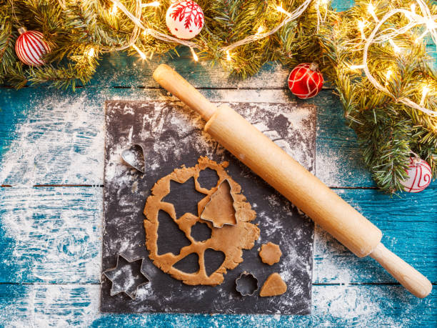 istock Photo of pine branches, dough, biscuit molds, rolling pin 1200308362