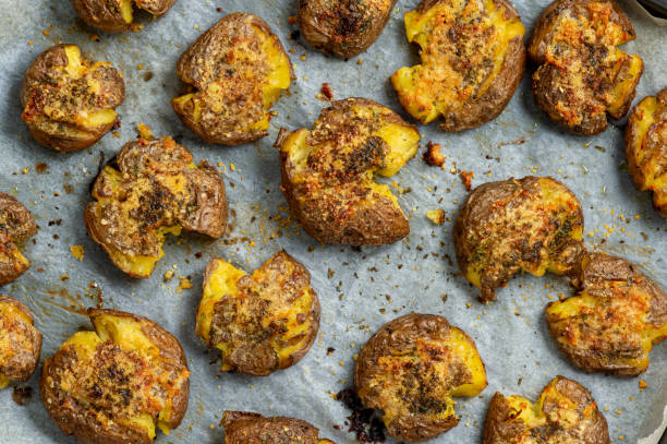 istock Crispy smashed potatoes roasted with garlic and parmesan. 1200308483
