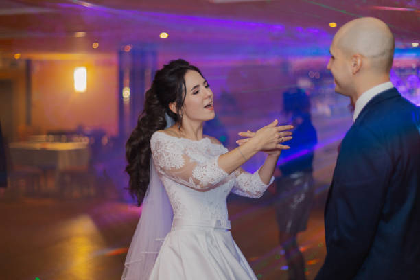 istock Happy newlyweds dancing on the dance floor 1200315454