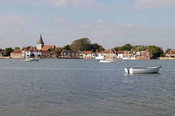 Bosham at high tide. West Sussex. England Bosham quay at high tide. Chichester Harbour. West Sussex. England chichester stock pictures, royalty-free photos & images