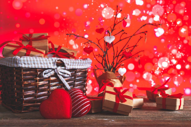 istock Valentines Day. Gift boxes set  zero waste. Gifts eco friendly craft paper boxes  red background, holiday concept, wedding invitation, greeting cards and mothers day. Long banner, March 8 Women's Day. 1200318583