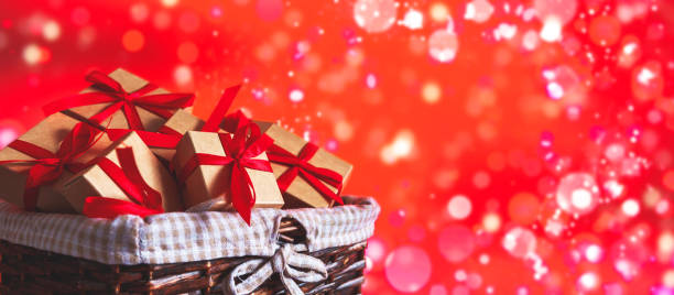 istock Valentines Day. Gift boxes set  zero waste. Gifts eco friendly craft paper boxes  red background, holiday concept, wedding invitation, greeting cards and mothers day. Long banner, March 8 Women's Day. 1200318613