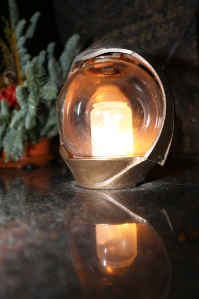 Lighting candles for the dead on All Saints Day