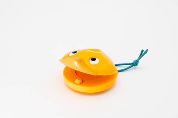 istock castanets for children in shape of a yellow duck 1200320075