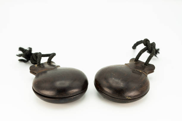 istock a pair of wooden castanets lying on a white underground 1200320691