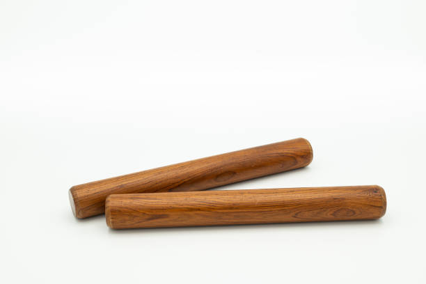 istock a pair of wooden claves lying on a white underground 1200320698