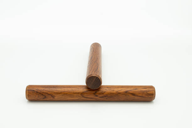 istock a pair of wooden claves lying on a white underground 1200320737