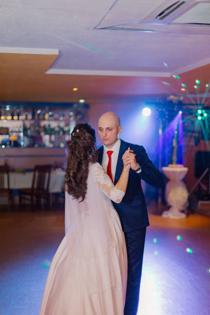 istock Happy newlyweds dance on the dance floor the first dance 1200321373