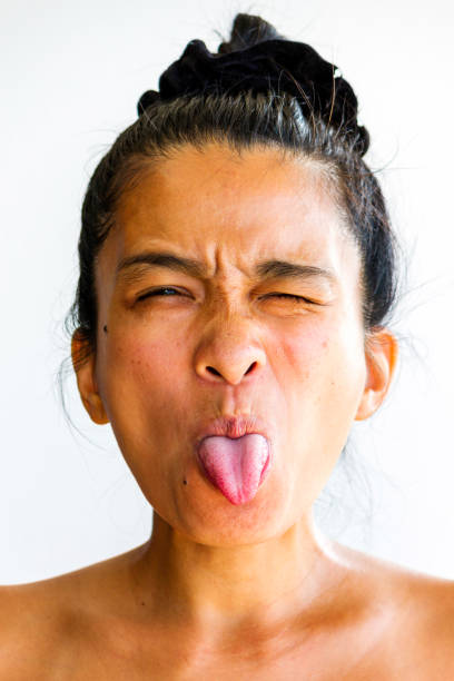 istock Woman Sticking Tongue Out 1200326116