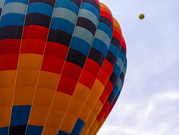 istock Multi colored Hot air balloons flying alone in Cappadocia, Turkey 1200326179