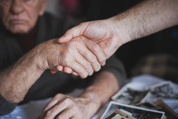 istock Holding hand -  grandson and grandfather 1200326228
