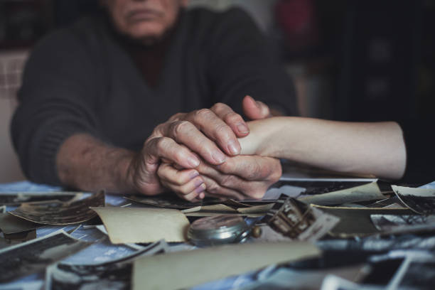 istock Holding hand -  grandson and grandfather 1200326424