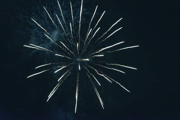 istock Bright green fireworks against the dark sky. 1200327121