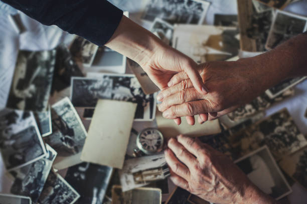 istock Holding hand -  grandson and grandfather 1200327508